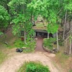 A Missouri engineer bought remote Ozarks land in 1970 and slowly built a reinforced-concrete home into the hillside; more than 50 years later, his son is restoring it room by room