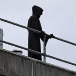 Man dressed as ‘Grim Reaper’ climbs onto hospital roof with long blade, apparently trying to scare patients | World News