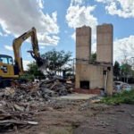 Cheyenne’s Twin Chimneys motor court stood for almost 90 years; this week its landmark chimneys fell in about 30 seconds to make way for a drive-thru coffee shop