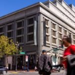 A 1.2-million-sq-ft San Francisco mall was foreclosed and a buyer walked away; a new bid would add 6 basketball courts, 8 volleyball courts and a sports high school