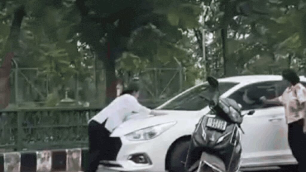 Woman clings to bonnet as boyfriend drives off car after argument | Lucknow News