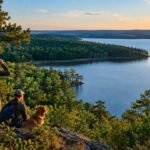 A North Carolina land trust has saved the first 200 acres around Tuckertown Reservoir after 1,400 donors joined the campaign; another 3,800 privately owned acres remain at risk of sale and development