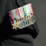 Veterans Lay Down Medals in Front of Parliament in Protest Over $5,000 Treatment Cap