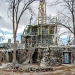 In 1969, a Nevada man began turning roadside junk, bottles, hubcaps and car parts into a desert home; decades later, the five-acre Thunder Mountain Monument is a free roadside attraction