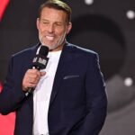 In 2014, Tony Robbins turned a childhood memory of his struggling family receiving groceries from a stranger into Feeding America’s 100 Million Meals Challenge; expanded later, it reached 1 billion meals in 2023